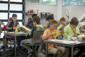 Students cutting paper