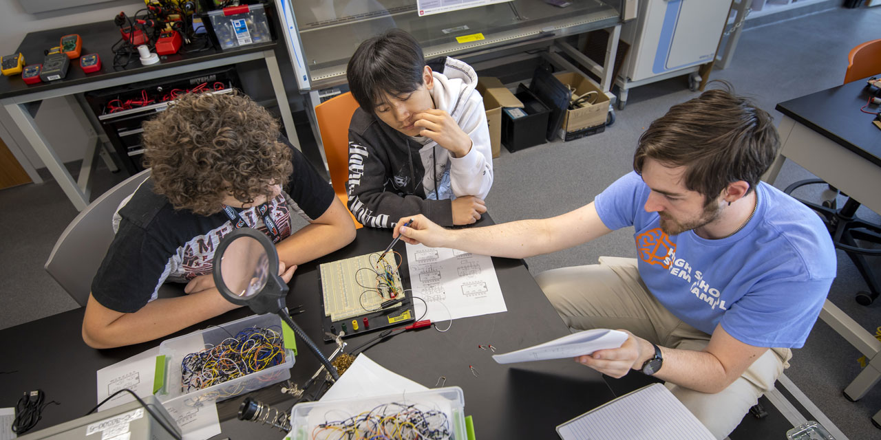 Campers wiring a breadboard
