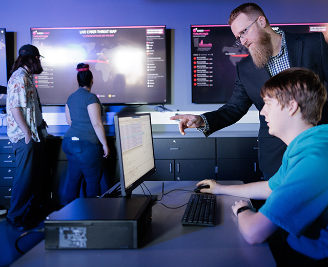 cybersecurity setting students working in Indiana Tech's cybersecurity center