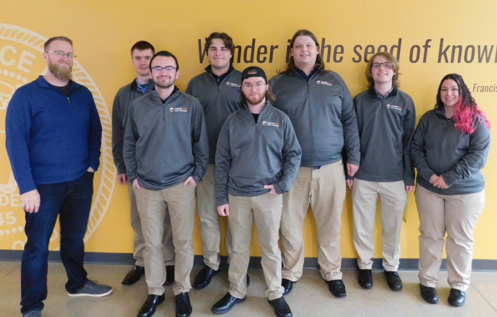 cyberwarriors for website The Cyber Warriors offensive security team, from left to right: Coach Matt Hansen, John Allen Rudolph, Garrett Bates, Myles Nieman, Bryce Murphy, Samuel Regelbrugge and Nia Iott. Jeremy MacRoberts is not pictured.
