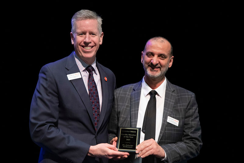 Dr. Einolf Presenting award to Dr. Al-Hamouz