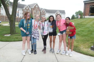 students posing on campus